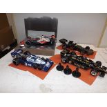 Exoto including:- Four formula one cars, two by Exoto, one by Minichamps and one other.