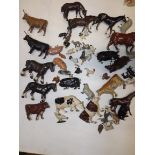 A collection of lead animals including horses, cows, pigs, chickens, etc.