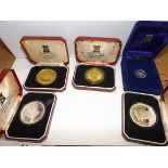 Isle of Man :- Five silver coins, three crown size, a pound and a 50 pence.