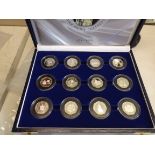 Silver proof collection of twelve 50p coins four of each Jersey, Guernsey and Alderney cased as one.