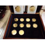 The Age of Steam:- Ten gold plated sterling silver crown size coins with certificates in wood case.