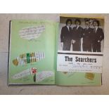 An autograph book including signatures by Sir Mat Busby, Bobby Charlton , The Searchers,