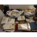 A large quantity of stamps in albums and loose including first day covers contained in two boxes.