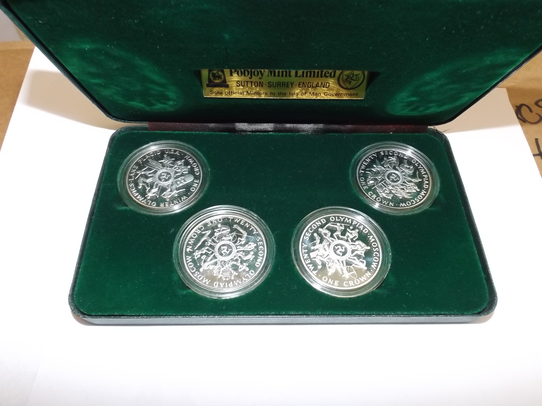 Isle of Man:- A 1980 Olympics set of four .925 silver proof crowns, cased.