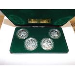 Isle of Man:- A 1980 Olympics set of four .925 silver proof crowns, cased.