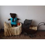 A 1920's dolls pram, an early 20th century iron cot and two teddy bears.