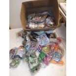 A quantity of sealed McDonalds Happy Meal toys.