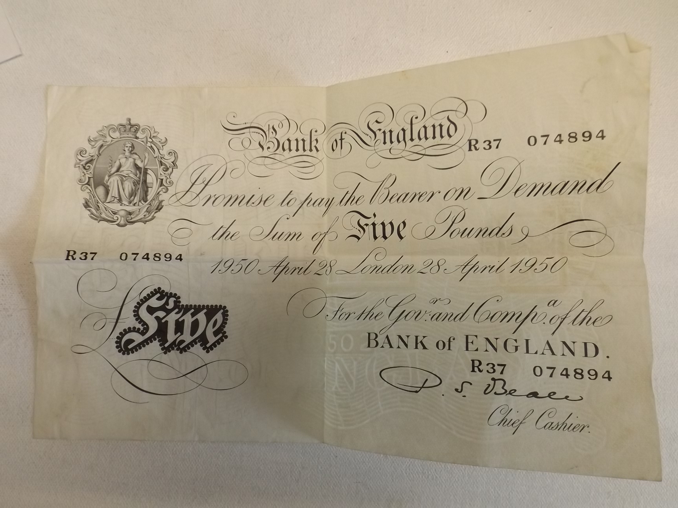 A white £5 note dated about 28th 1950.