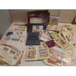 A collection of first day covers, P.H.Q. cards loose stamps etc.