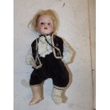 A porcelain head doll, head impressed "MOA 150 Welsch Made in Germany,