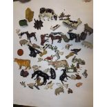 A collection of lead animals including cows, sheep, chickens, a greyhound etc.