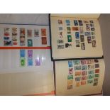 A large stock book and two albums of world stamps.