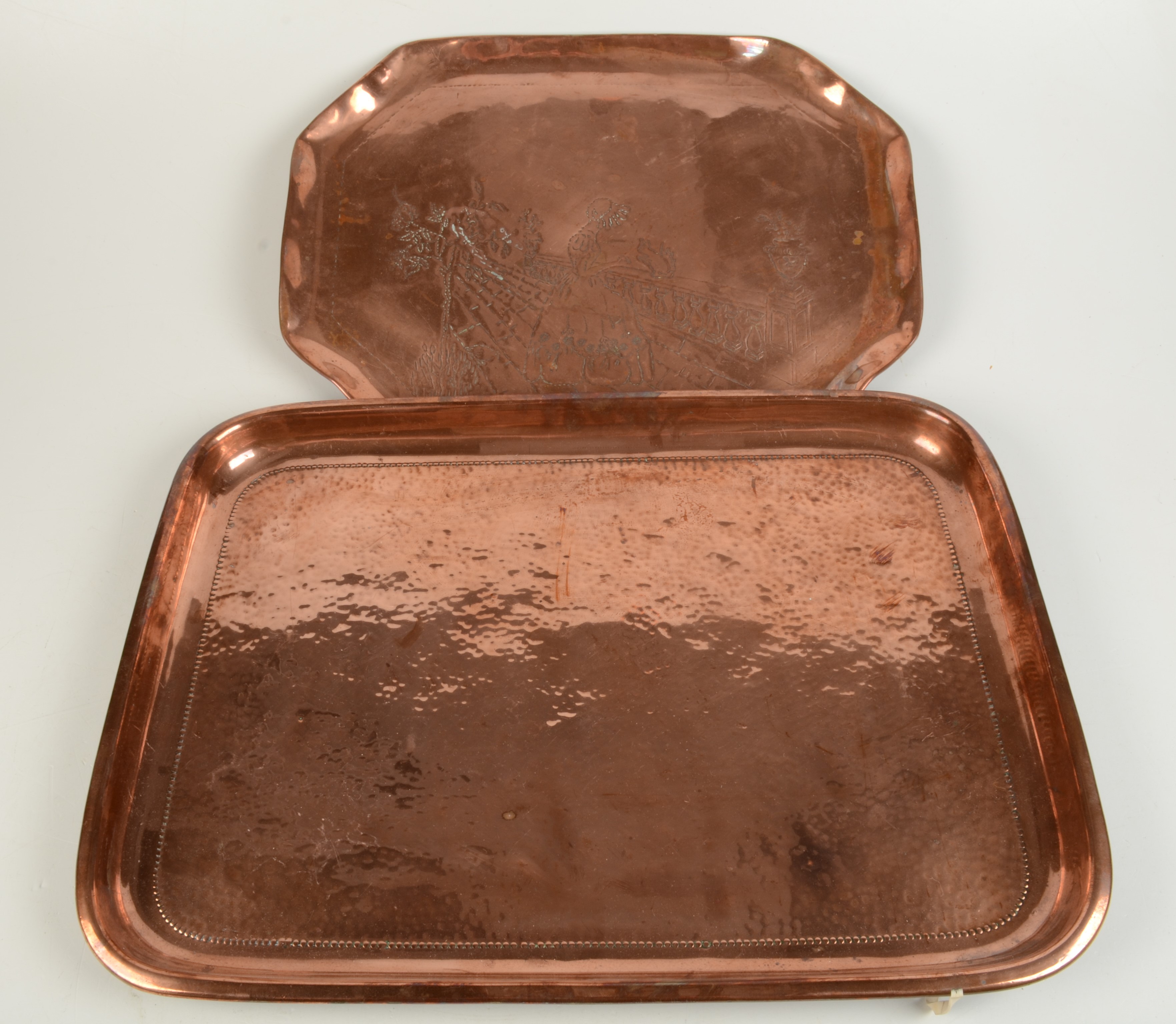 Two copper trays, early 20th century, widths 51cm and 43.