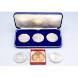 A set of three silver commemorative medallions,
