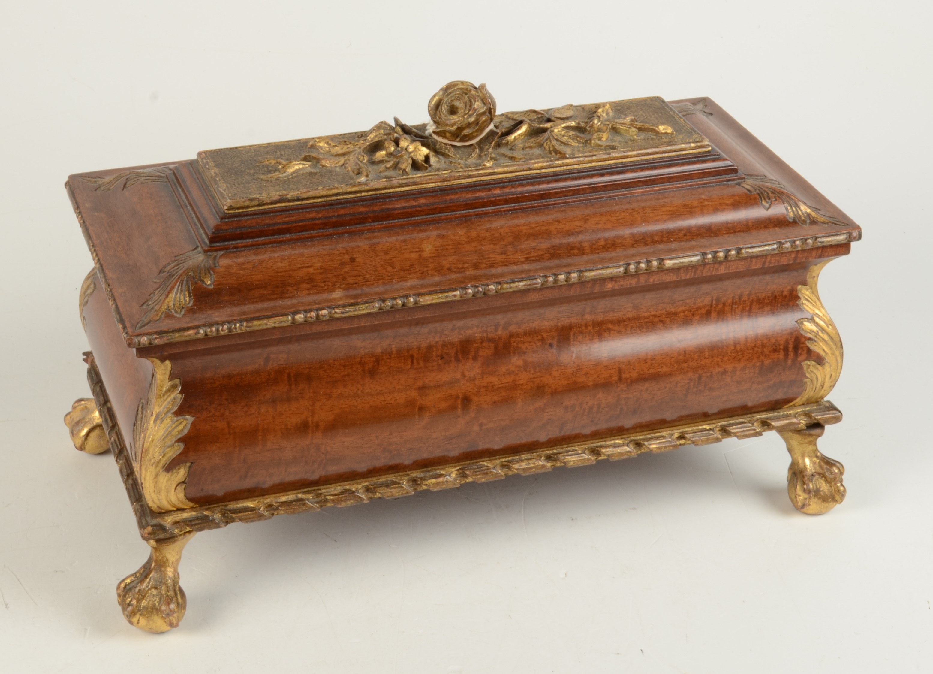 A carved parcel gilt casket,