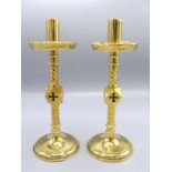 A pair of Gothic brass candlesticks, in the manner of Pugin, height 26cm.