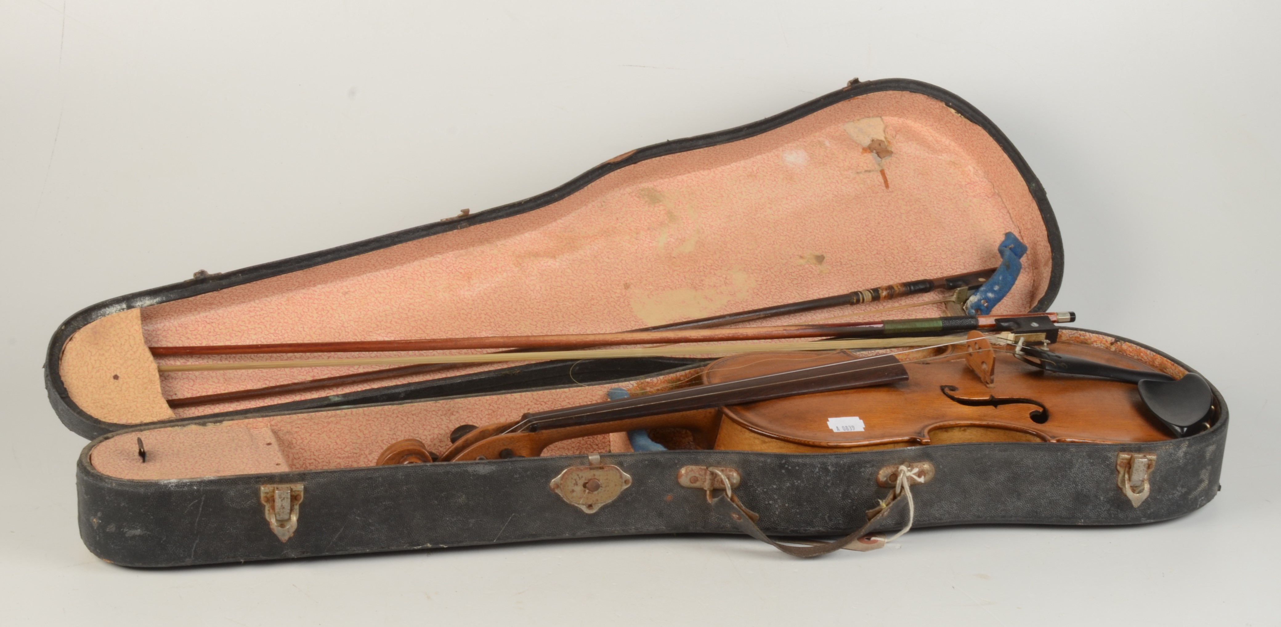 A cased violin and two bows, length of back 37cm.
