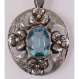 An Arts and Crafts silver blue stone set pendant on silver snake chain.