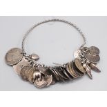 A silver bracelet mounted with numerous silver coins.