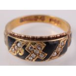 A 15ct gold late Victorian, black enamel mourning ring set a diamond cross and pearls, Chester 1900.
