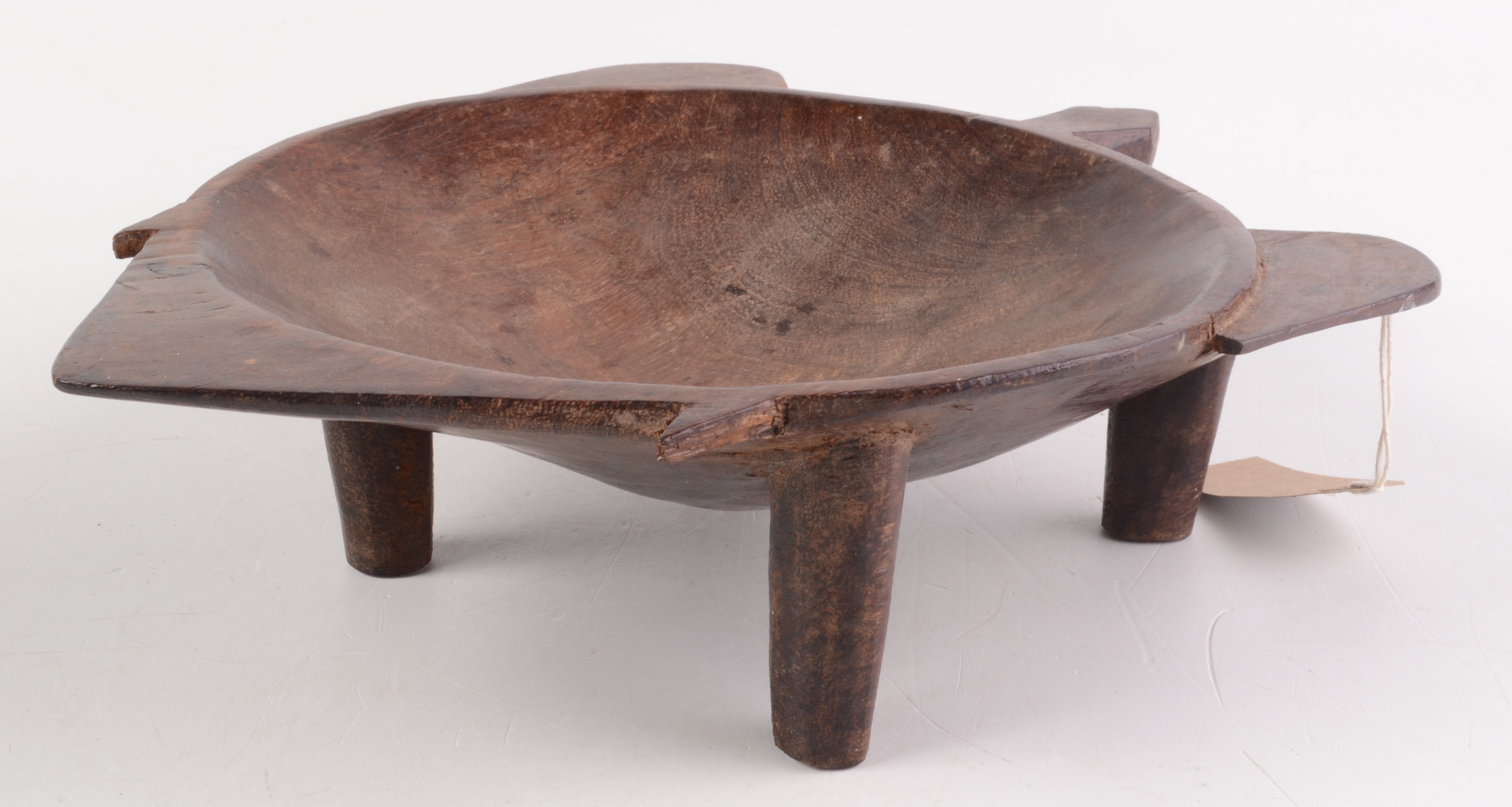 A Fijian carved hardwood kava bowl of turtle shaped outline, raised on four peg feet, length 35cm,