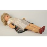 An all composition walkie doll, her head turns as she walks, mama voice box. Full length 74cm.