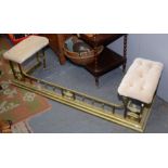 A brass club fender, early 20th century, with buttoned upholstered padded seats,