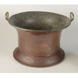 An Art Deco copper coal bucket with a pair of brass carrying handles, diameter 41cm, height 26cm.