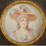 Miniature portrait of a fashionable lady Indistinctly signed 4cm diameter