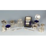 A cased silver napkin ring and three other silver napkin rings together with various silver