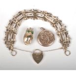 A 9ct gold five bar gate-link bracelet, 10g, together with a gold locket and a gold owl charm.