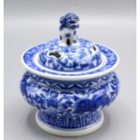 A Chinese blue and white potpourri holder and cover, the pierced cover surmounted by a dog of fo,