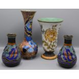 A pair of Gouda pottery vases, each decorated with leaves, height 16cm, a large Gouda trumpet vase,