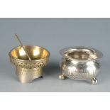 Two Russian silver salts and a small Russian silver bowl on three ball feet and a Russian silver