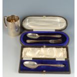 A silver christening spoon and fork cased,