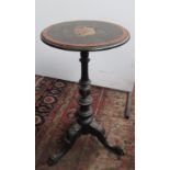 A Victorian ebonised and amboyna wine table, with gilt metal mounts,