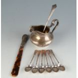 A Victorian silver bellied cream jug together with a set of six silver coffee spoons and one other