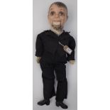 A 1940/50s ventriloquist's dummy with composition head arms and feet and fabric body,