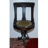 A late 19th century walnut ship's swivel dining chair,