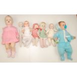 Seven miscellaneous dolls in plastic composition and porcelain,