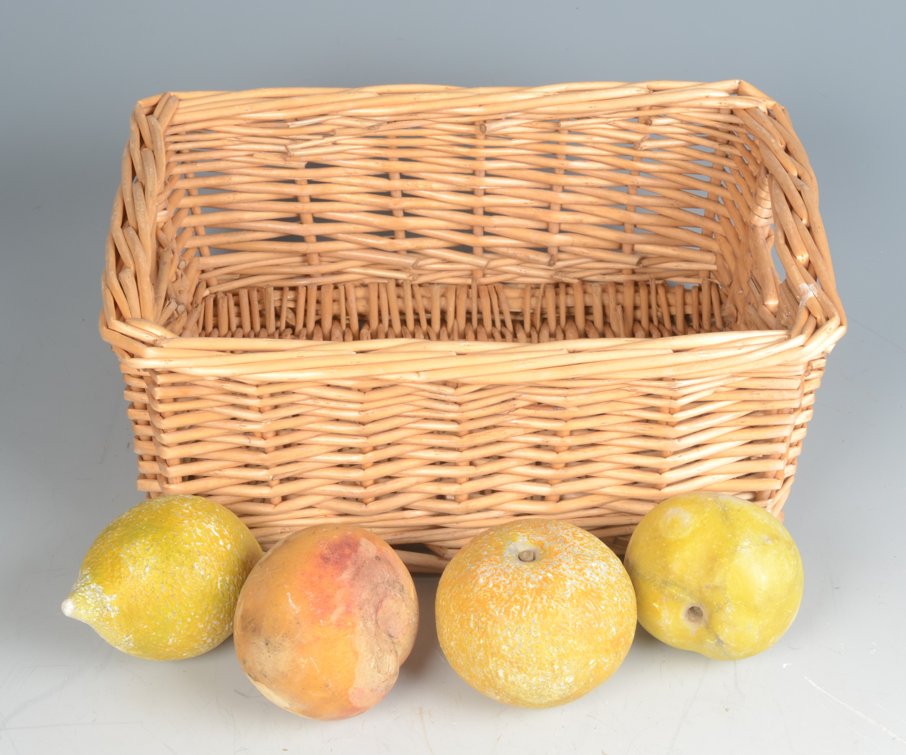 Four alabaster models of fruits, a lemon, an orange, a peach and a quince, largest diameter 7cm.