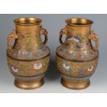 A pair of Chinese champleve enamel vases, each with a floral decorated body, height 30cm.
