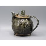 A Ruthanne Tudball brown and green glazed stoneware teapot, height 17cm.