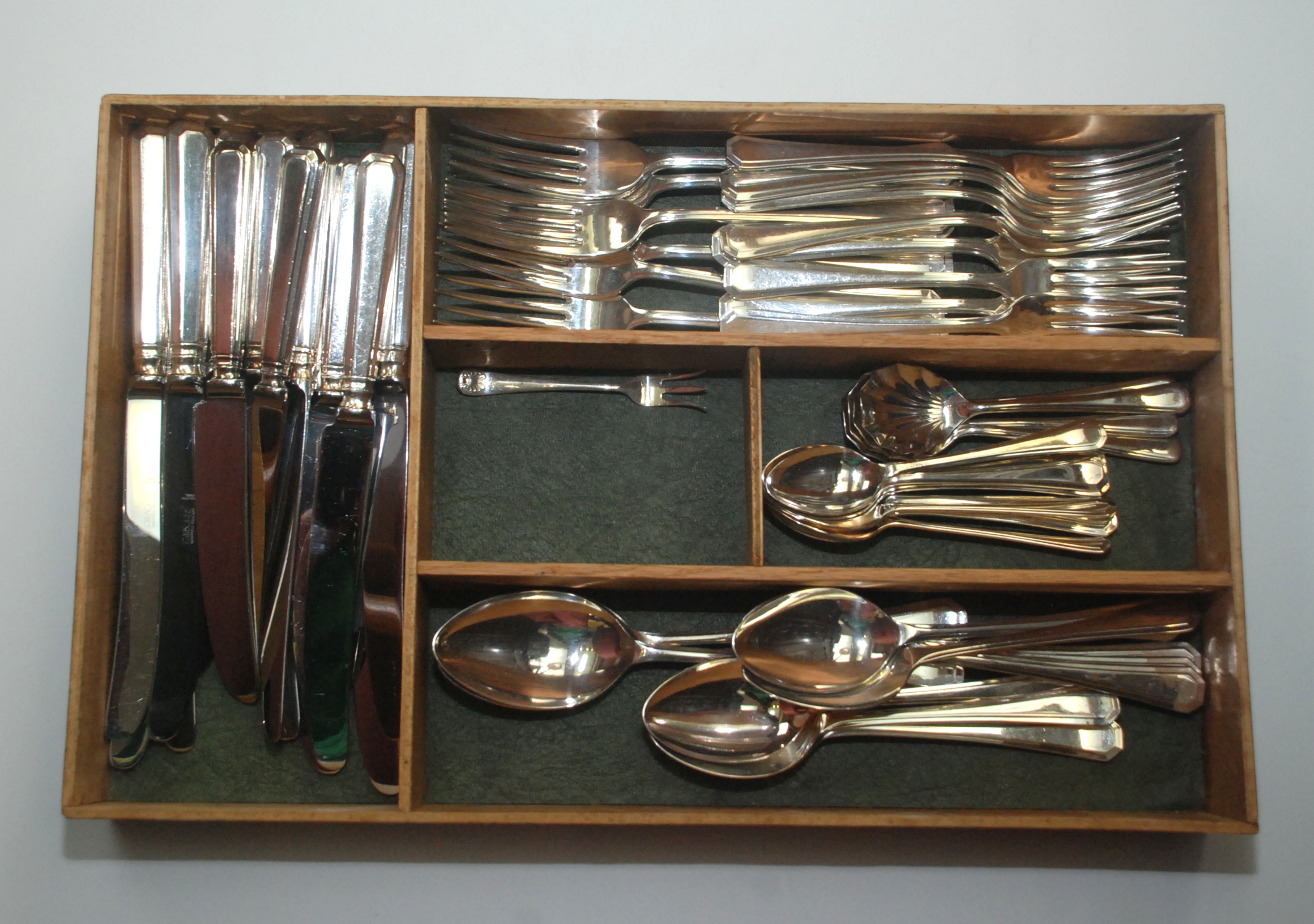 A 1930s style eight place setting suite of cutlery and other plate.