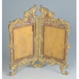 A gilt metal and champleve folding photograph frame, early 20th century, height 29cm, width 27.5cm.