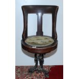 A late 19th century walnut ship's swivel dining chair,