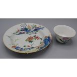 A Chinese porcelain famille rose shallow bowl, 18th century, painted with a pavilion scene,