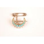 A gold pearl and turquoise set crescent brooch.