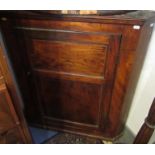 An elm corner cupboard, 19th century, height 102cm, width 85cm.