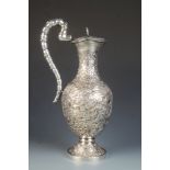 A Chinese silver pitcher/claret jug with hinge cover,
